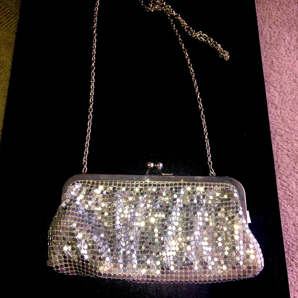 Silver sequin clutch bag